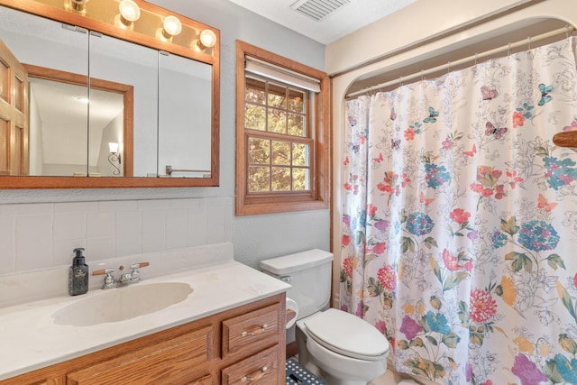 bathroom featuring a shower with curtain, decorative backsplash, toilet, and vanity