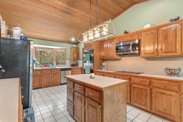 kitchen with decorative backsplash, a center island, wood ceiling, and stainless steel appliances