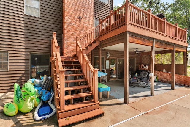 exterior space with a deck and ceiling fan