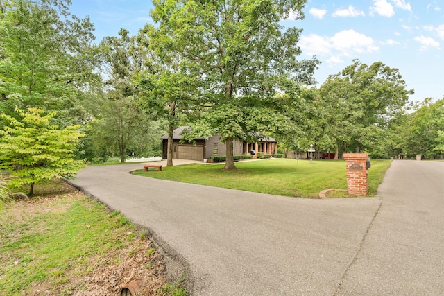 view of front facade with a garage and a front yard