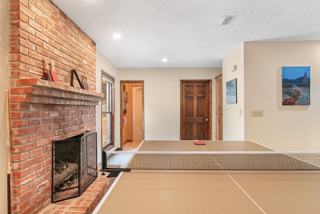 interior space featuring a fireplace and a textured ceiling