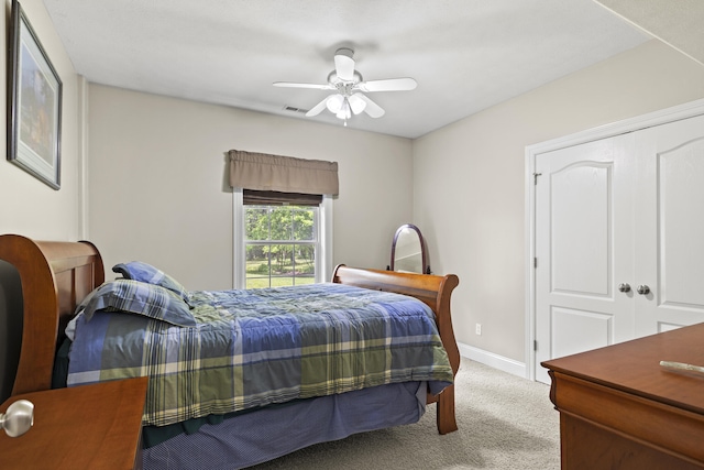 bedroom featuring ceiling fan and light colored carpet