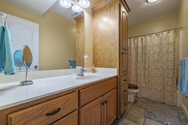 full bathroom featuring tile patterned floors, vanity, toilet, and shower / bath combo