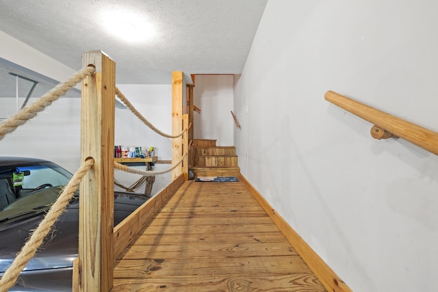 interior space with hardwood / wood-style floors and a textured ceiling