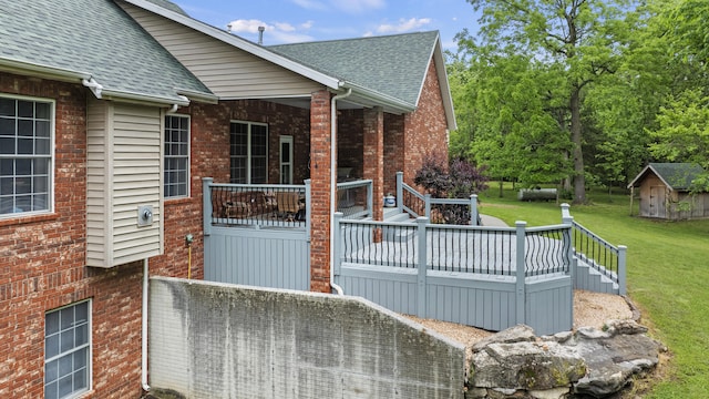 wooden terrace with a yard