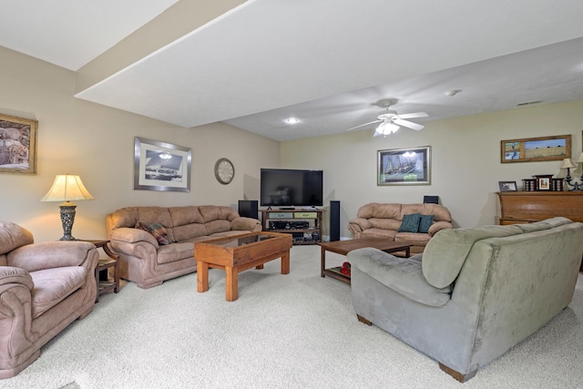 carpeted living room featuring ceiling fan