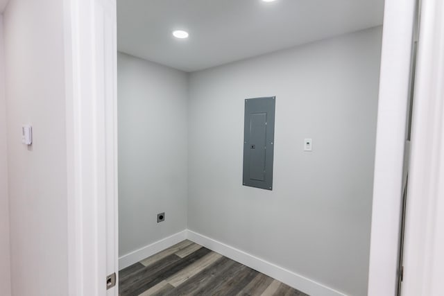 laundry area with hookup for an electric dryer, dark hardwood / wood-style floors, and electric panel