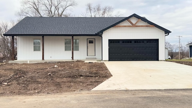 view of front of home with covered porch and a garage