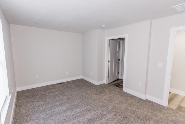 spare room featuring carpet floors