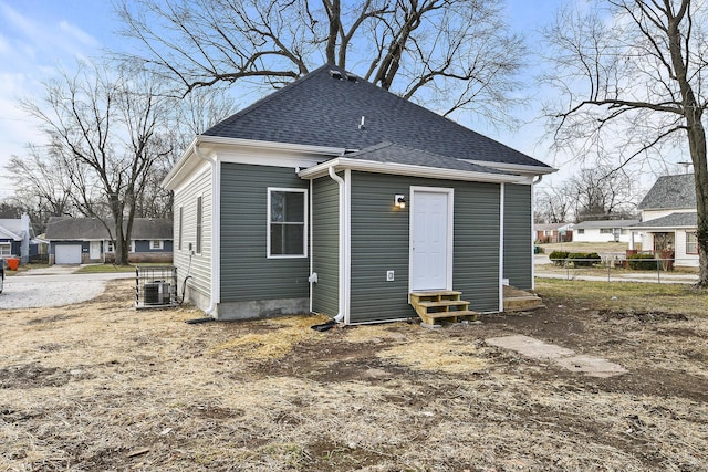 back of property featuring cooling unit