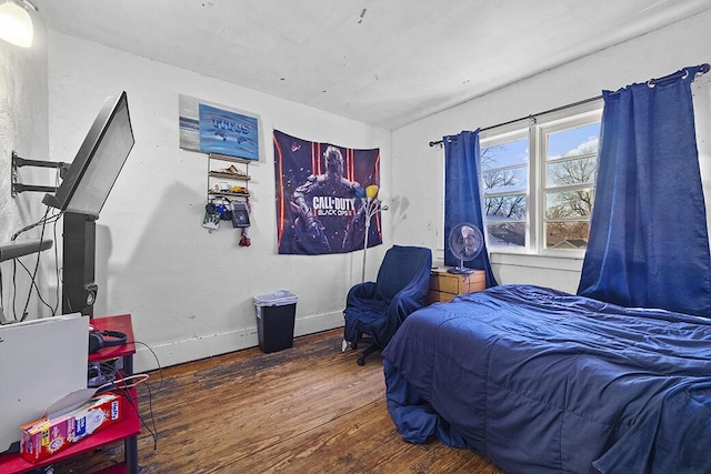 bedroom with dark wood-type flooring