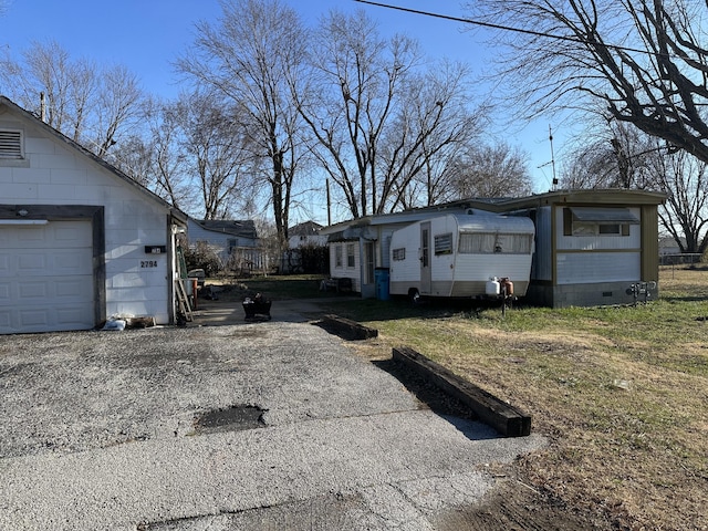 view of property exterior featuring a garage