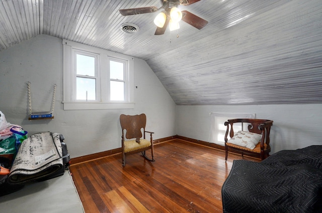 sitting room featuring ceiling fan, wood-type flooring, and lofted ceiling