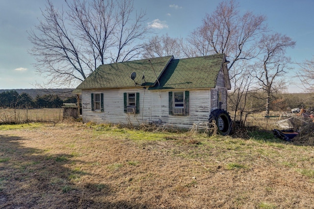 view of property exterior featuring a lawn