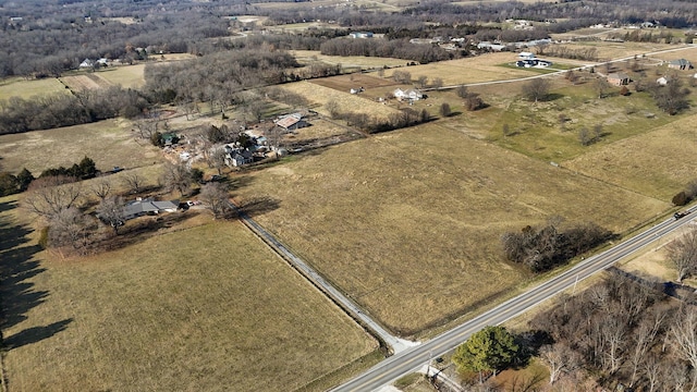 birds eye view of property featuring a rural view