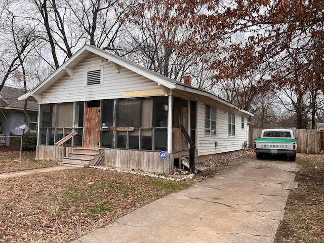 view of front of house with a sunroom