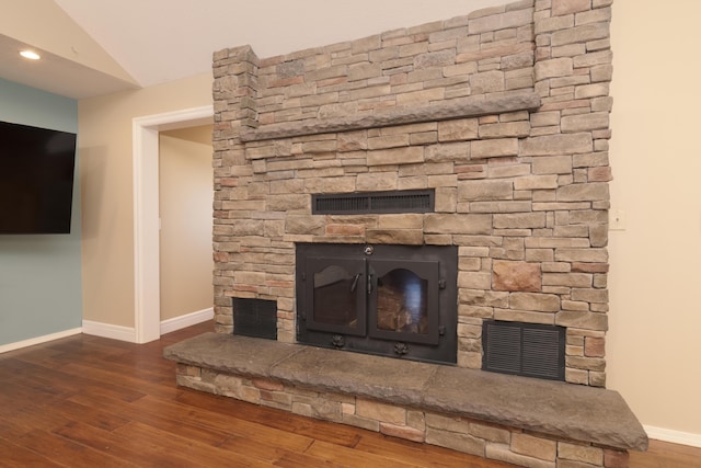 1012 W Monarch Dr, Nixa, MO 65714 - detailed view of a stone fireplace, wood finished floors, and recessed lighting