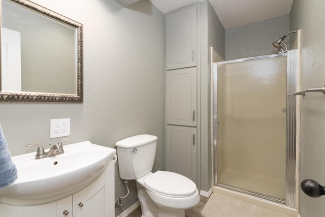 1012 W Monarch Dr, Nixa, MO 65714 - bathroom with a shower stall, vanity, and a textured ceiling