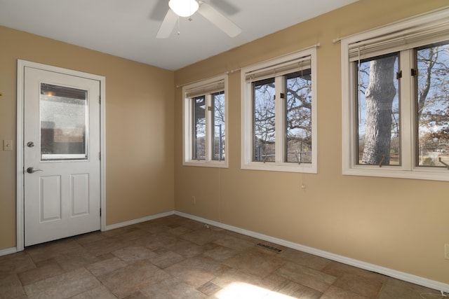1012 W Monarch Dr, Nixa, MO 65714 - entryway with stone finish floors and ceiling fan