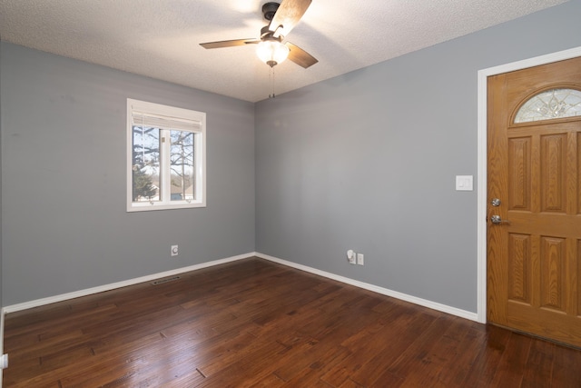 1012 W Monarch Dr, Nixa, MO 65714 - entryway with ceiling fan, dark wood-type flooring, and a textured ceiling
