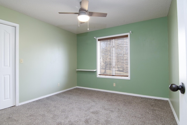 1012 W Monarch Dr, Nixa, MO 65714 - spare room with carpet floors and ceiling fan