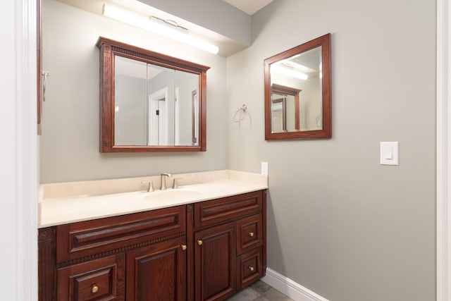 1012 W Monarch Dr, Nixa, MO 65714 - bathroom with vanity and tile patterned flooring