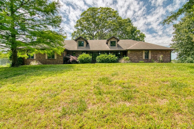 1012 W Monarch Dr, Nixa, MO 65714 - view of front facade with a front lawn, a shingled roof, and brick siding