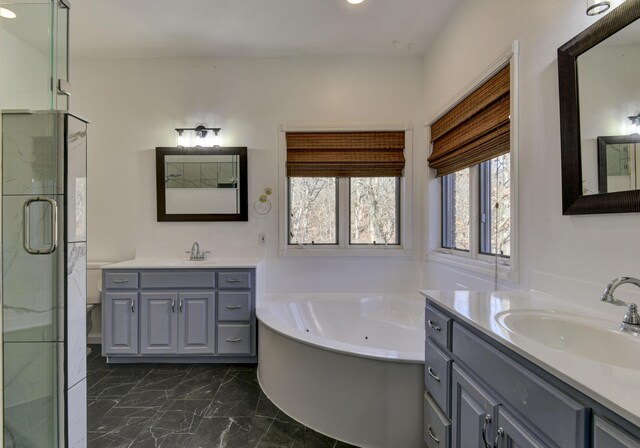 bathroom with plus walk in shower and vanity