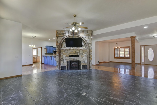 unfurnished living room featuring ceiling fan and a fireplace