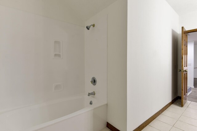 bathroom featuring tile patterned flooring and shower / tub combination