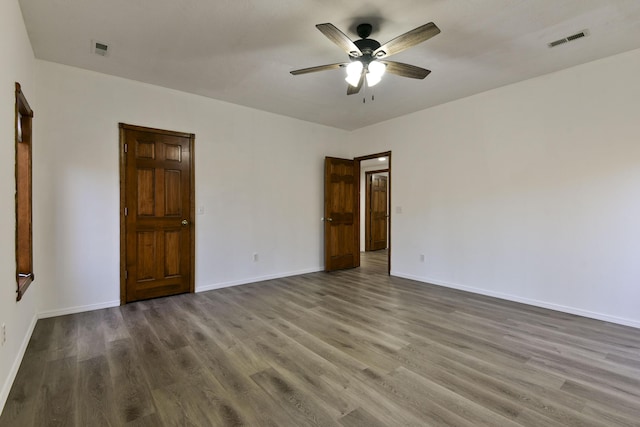 unfurnished bedroom with hardwood / wood-style floors and ceiling fan