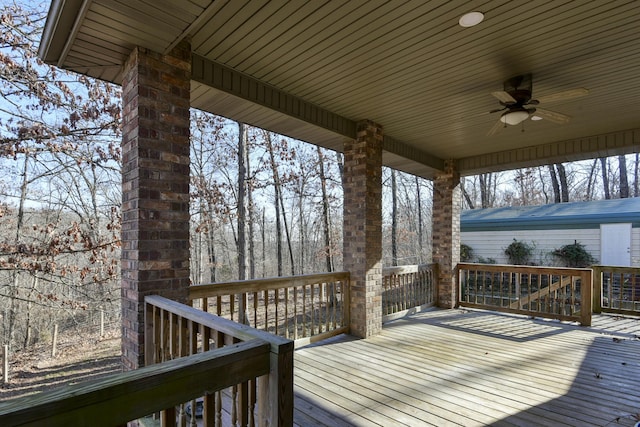 wooden deck featuring ceiling fan