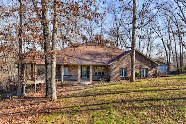 rear view of house with a yard