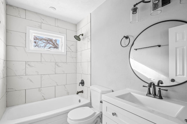 full bathroom with toilet, tiled shower / bath combo, and vanity