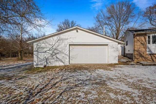 view of snow covered garage