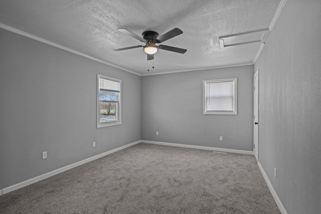 unfurnished room with carpet flooring, a textured ceiling, ornamental molding, and ceiling fan