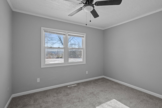 unfurnished room with a textured ceiling, ceiling fan, carpet, and ornamental molding