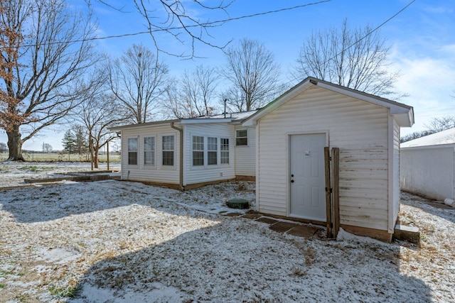 view of snow covered house