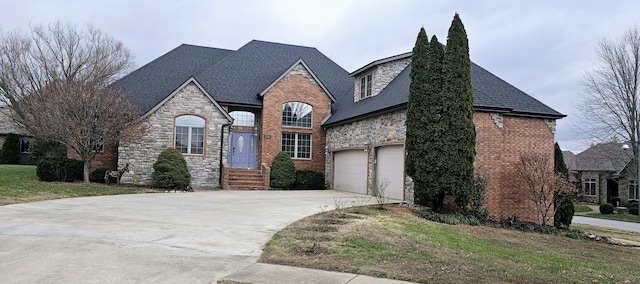 french country style house featuring a garage and a front yard