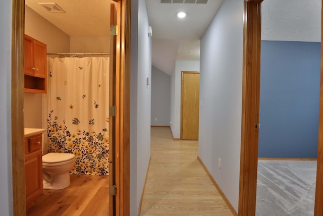 hallway with light wood-type flooring