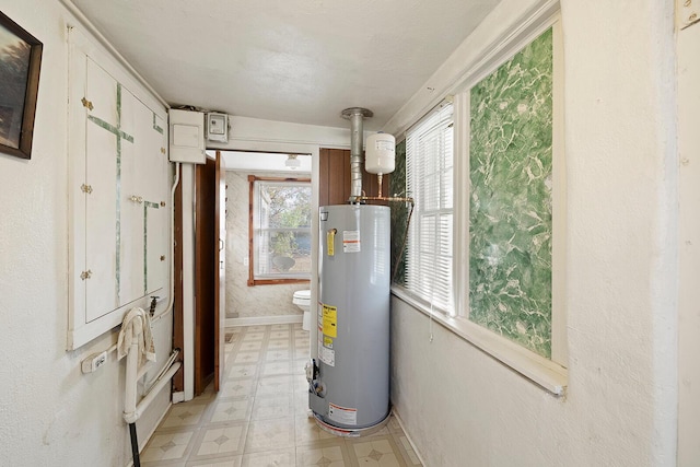 utility room featuring gas water heater