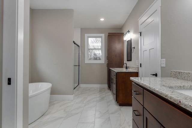 bathroom with vanity and separate shower and tub