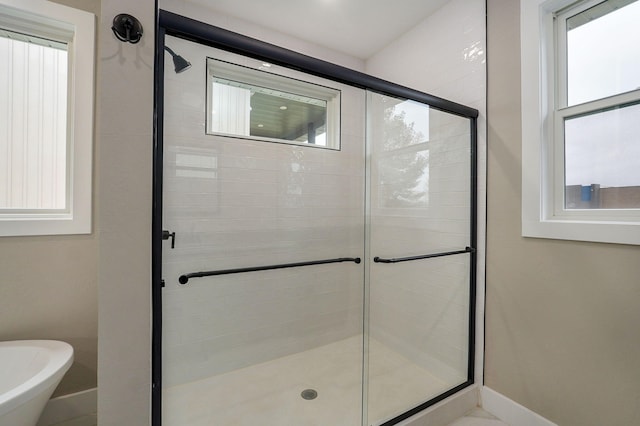 bathroom with shower with separate bathtub