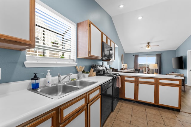 kitchen with ceiling fan, sink, black appliances, white cabinetry, and lofted ceiling