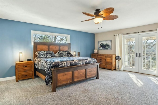 carpeted bedroom with access to outside, ceiling fan, and french doors