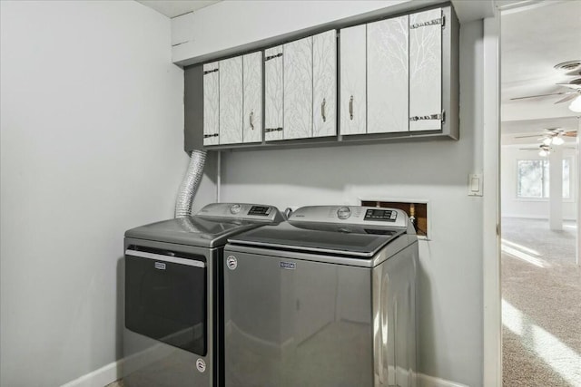 laundry room featuring carpet flooring, washer and dryer, ceiling fan, and cabinets