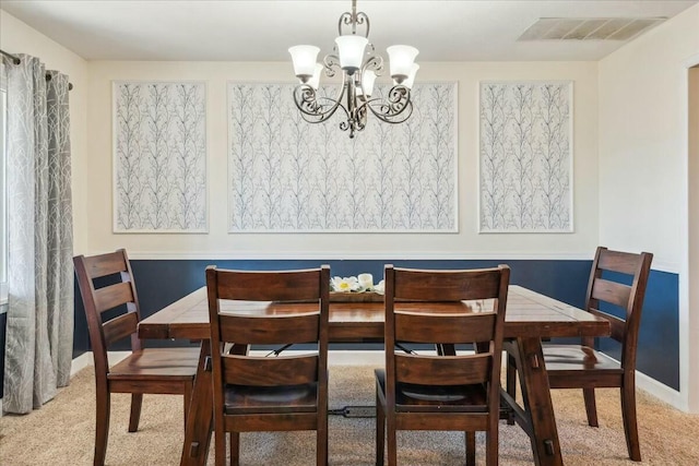 carpeted dining space with a notable chandelier