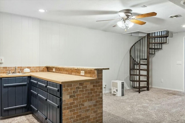 bar featuring ceiling fan, light colored carpet, and sink