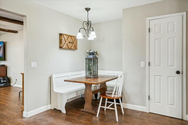 dining area featuring beamed ceiling, wood-type flooring, and a chandelier