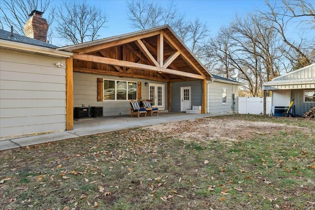 back of property with french doors and a patio